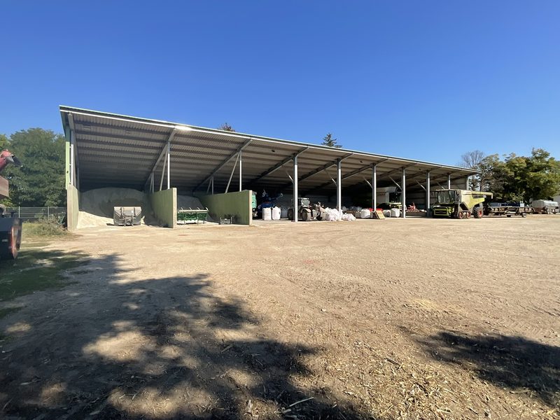 An open, monopitch shed for implements and harvesting machinery.